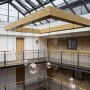 Residential apartment building atrium - Wapping High Street | Bespoke industrial 12 pendant chandelier | Interior Designers